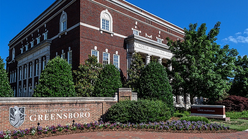 The University of North Carolina at Greensboro entrance sign and auditorium building