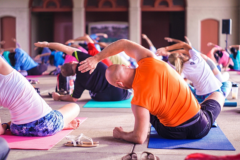 Participants stretching together during a group wellness session