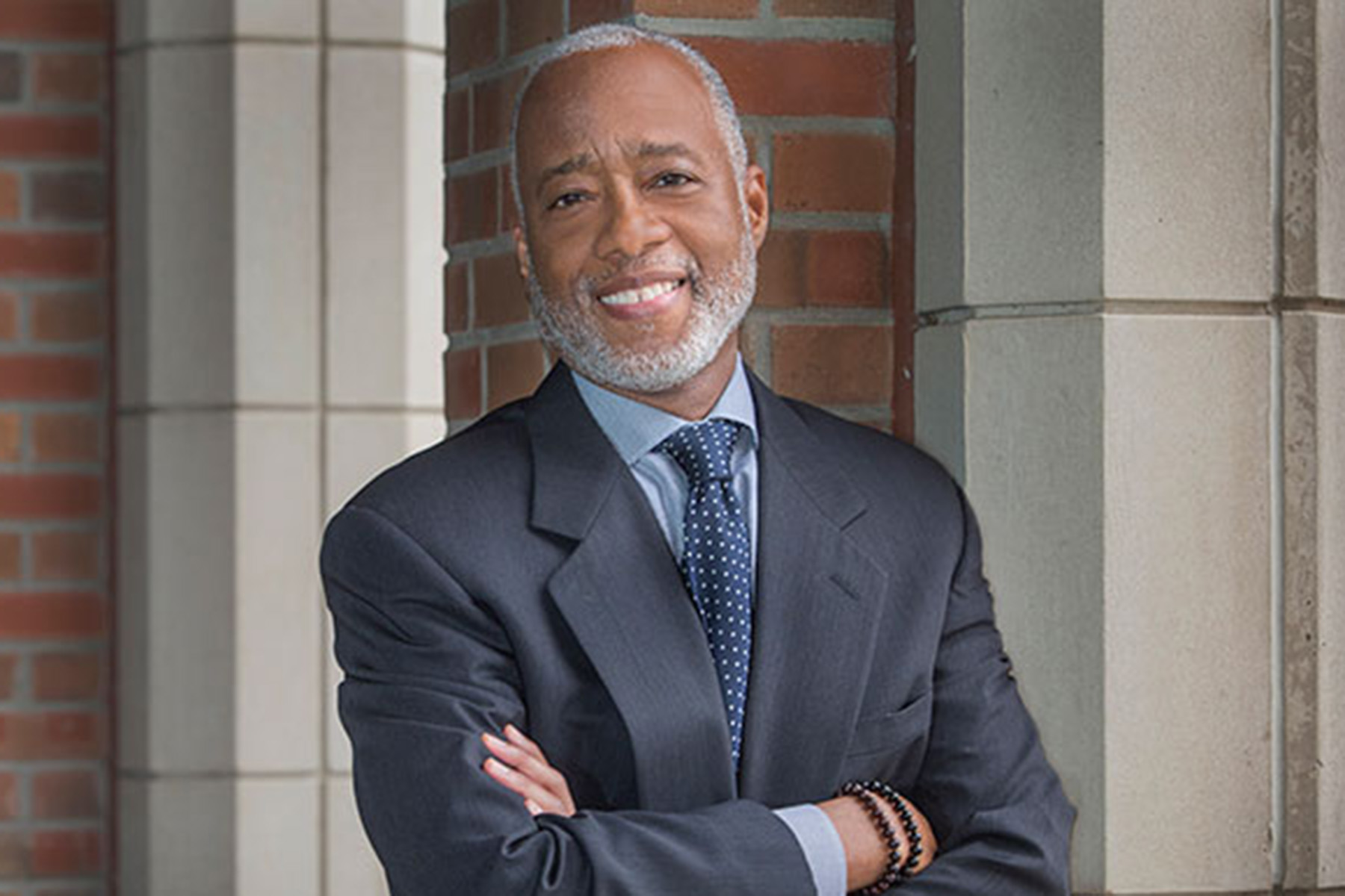 Portrait of Dr. Norman B. Anderson in a navy suit